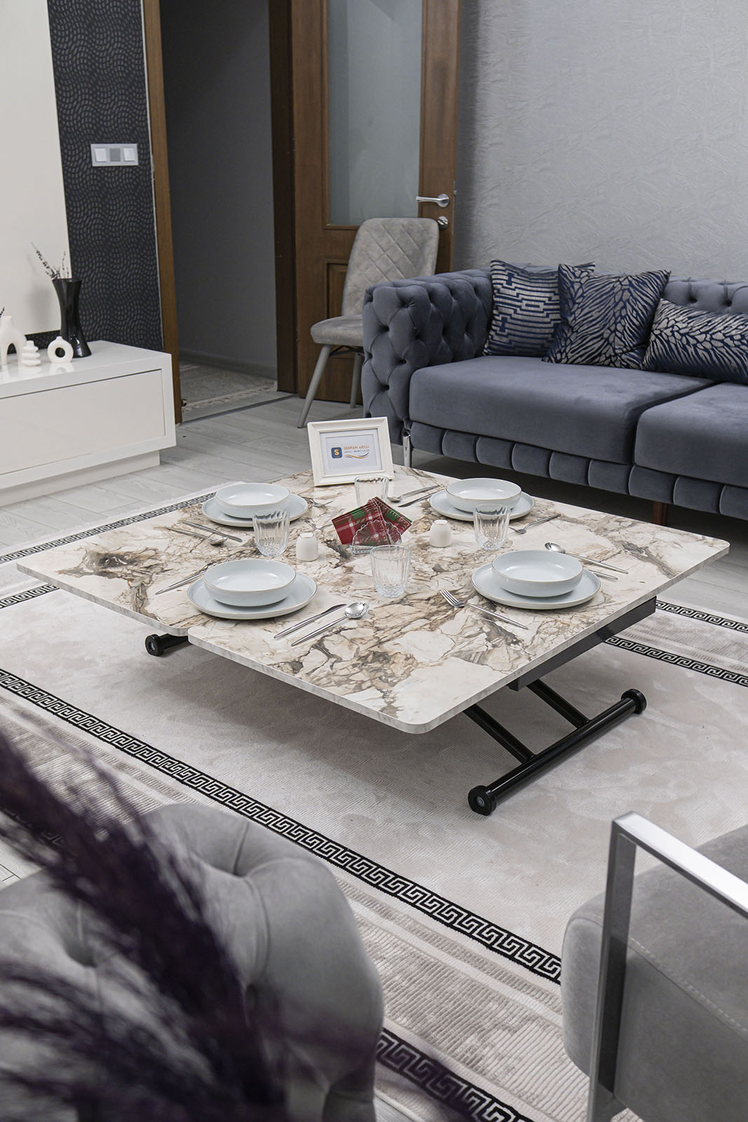 Juppo Smart Coffee Table – White Marble MDF Top & Black Outward Curved Metal Leg